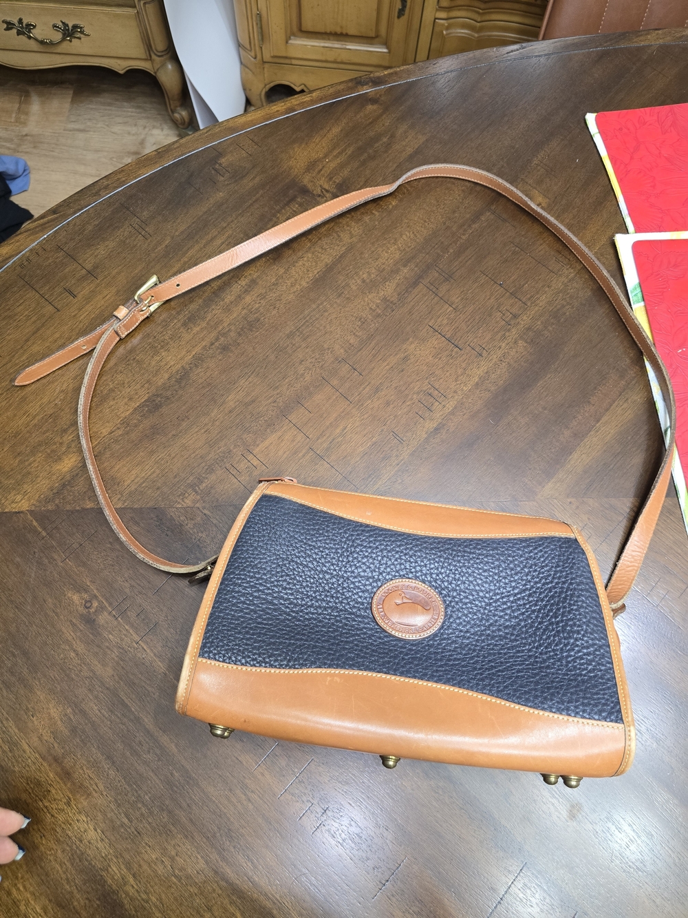Dooney & Bourke Black and Tan Pebbled Leather Crossbody Bag